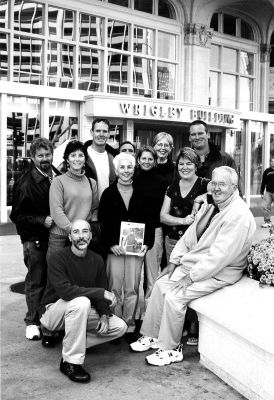 010804
A group of tri-town area residents recently traveled to Chicago, IL to attend the wedding of John Mello and Dawn Peterson and took the time to pose in front of the famed Wrigley Building with a copy of The Wanderer. Pictured here at the famous site are (rear, l. to r.) Robert Bertrand, Todd Henshaw, Lenny DiPasqua, Polly Henshaw, Jonathan Henshaw, (middle, l. to r.) Lisa Bertrand, Patty DiPasqua, Susan Henshaw, Kim Henshaw, and (front) Phillip Mello and George Henshaw. 1/8/04 edition
