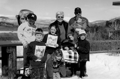 04-12-01-7
The Hughes family of Rochester took a ski trip to the White Mountains of New Hampshire last month. Posing in front of the scenic overview in North Conway, NH with copies of The Wanderer are David and Louise Hughes of Rochester with their seven grandchildren: (l. to r.) Andrew Hughes (6), Michael Pruchnik (5), Kara Hughes (8), Jennifer Hughes (3), McNeil Somers (3 weeks), Nicole Pruchnik (6) and Kate Hughes (1). Also enjoying the beautiful spring weather and skiing trip (but not pictured here) were Stephen and Michelle Hughes of Mattapoisett, Carolyn and Frank Pruchnik of Rochester, Colleen and John Somers of Dorchester, and Mark and Marissa Hughes of Rochester. (Photo courtesy of Louise Hughes.) 4/12/01 edition
