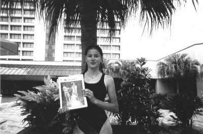 041505-1
Catherine Lavallee of Widemarsh Beach in Fairhaven recently accompanied her parents and brother to a business convention in Tampa, FL and took along a copy of The Wanderer to read while relaxing by the pool. (Photo courtesy of Donna Lavallee). 4/15/04 edition
