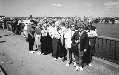 041703-3
Members of the Mattapoisett Touring Club all posed with a copy of The Wanderer during a trip the group took to Stockholm, Sweden last June. The group members are posing here in front of the Baltic Sea, visible in the background. (Photo courtesy of Kay Levine). 4/17/03 edition
