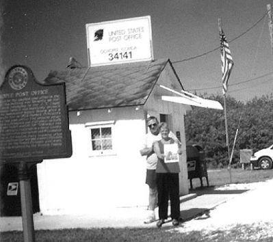 05-23-02-7
Dave Anmahian of Mattapoisett and his wife Jan recently posed with a copy of The Wanderer at the countrys smallest post office located in Ochopee, near the Florida Everglades. 5/23/02 edition
