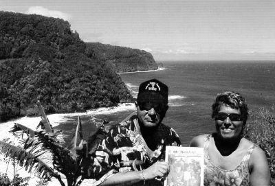 071504-3
Donald and Carol Lamarr of Mattapoisett remembered to bring a copy of The Wanderer along with them on their recent trip to Maui. Here they can be seen in the scenic setting on one of many stops on the Road to Hana. 7/15/04 edition
