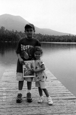 08-30-01-3
Jack and Hallie Thomas of Mattapoisett pose with a copy of The Wanderer during a recent family vacation at Baxter State Park in Millinoket, Maine with Mount Katahdin visible in the background. 8/30/01 edition
