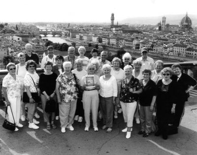 090904-4
Well-traveled members of the Mattapoisett Touring Club pose with a copy of The Wanderer during one of their recent ventures to Florence, Italy. The trip also included Rome and Tuscany.  9/9/04 edition
