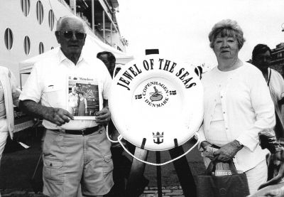 090904-5
Frances and Larry Cairns of Mattapoisett pose with a copy of The Wanderer in Denmark during a recent 12-night Scandinavian and Russian cruise aboard Royal Caribbean which also took them to England, Finland, Sweden and Norway. (Photo courtesy of Frances Cairns). 9/9/04 edition
