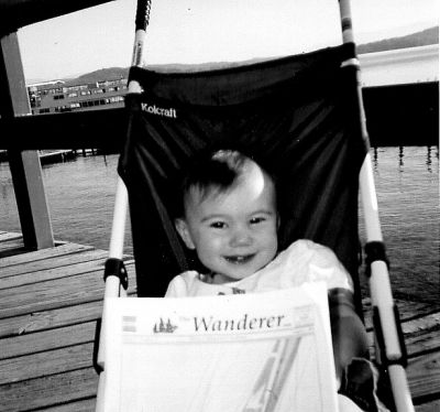 12-26-02-4
Lauren Jade Craig, daughter of David and Melissa Craig of Marion, holds The Wanderer on the familys recent getaway to Lake Winnipesaukee in New Hampshire. Lauren is sitting on the boardwalk at Weirs Beach in front of MS Mount Washington. 12/26/02 edition
