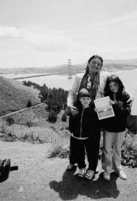 121803-3
Aunt Mercy (Mercedes) Murolo of Mattapoisett is seen posing here with Fredric and Lily Murolo  and a copy of The Wanderer  in San Francisco during a recent summer trip. (Photo courtesy of Mercy Murolo). 12/18/03 edition
