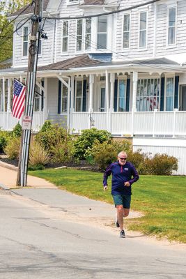Village Running
A runner goes through his paces on Tuesday morning in Mattapoisett village. Due to safety concerns, the 50th Fourth of July Road Race will not be held as scheduled, but a virtual race will be held on an individual basis with proceeds going toward stipends traditionally established to assist Old Rochester Regional High School graduating seniors. See Sports Roundup by Nick Friar. Photo by Ryan Feeney - May 14, 2020 edition
