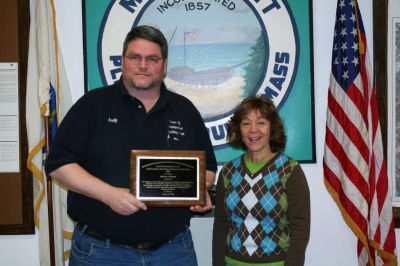 Top Inspector
Mattapoisett Building Inspector Andy Bobola was recognized by the Southeastern Massachusetts Building Officials Association as "Building Inspector of the Year" at a January 13 SEMBOA meeting. Mr. Bobola said that he was "greatly humbled" by the honor. Mr. Bobola poses here with his assistant Maria Cananzey holding his plaque on January 15. Photo by Anne O'Brien-Kakley.
