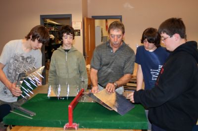 Aviators Club
ORRJHS students learn about the constructing of airplane parts from
volunteer Dave Rogers at the school's Aviation Club. (l to r: Will Rogers,
Jeff Rogers, instructor Dave Rogers, Matt Brides, Brian Reed) Photo by Adam Silva
