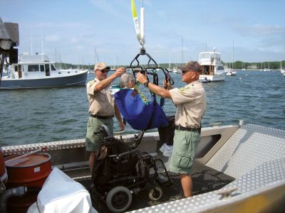 Boat Lift
On June 10, 2011 a boat lift for the handicapped, designed and built by Marion harbor crew, was given its first test-run. They first tested its strength by lifting the harbormaster's boat. Photo courtesy of Pat Cunning.
