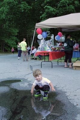 Brotherhood Ride 
Josh Fardy Jr., 21 months, had himself a ball the way only a kid can, stomping his firefighter boots to the music and splashing in a puddle during the June 12 Kids Brotherhood Ride at Old Colony Regional Vocational Technical High School. The Marion resident's father, Josh Fardy Sr., is a Marion firefighter. Children preregistered for the event that raised upwards of $3,000 that will go to families affected by the loss of a first responder in the line of duty. Photo by Mick Colageo - June 17, 2021 edition
