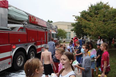 Sippican Elementary Car Wash
Sippican Elementary sixth graders turned Saturday's car wash into a fire engine wash, creating a waterfall of suds and having the kind of fun kids normally associate with what happens on the weekends before school is back in session. Organized by Volunteers at Sippican Elementary (VASE), the school's 501(c)(3) non-profit parent-teacher organization, the event held at the Marion school's bus loop off Main Street raised money for the students' mountain classroom trip, a three-day excursion planned for June 20
