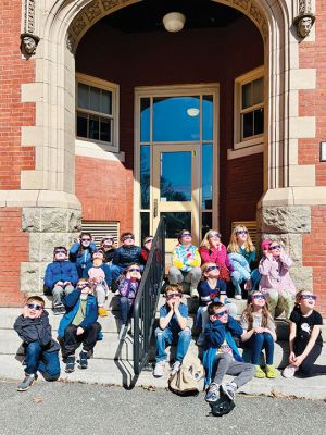Eclipse Day
Members of the second-grade class at Center School in Mattapoisett get ready for Monday afternoon’s solar eclipse. Specially filtered sunglasses were the item of the day from southwest to northeast across Mexico, the United States and Canada in succession, as millions of people traveled hundreds of miles to observe this rare astronomical phenomenon from the path of totality. Photo courtesy Michele Barry - April 11, 2024 edition
