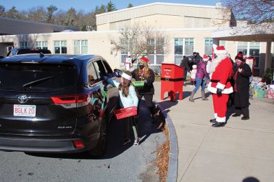 Fill-A-Cruiser Toy Drive
Sunday’s Fill-A-Cruiser toy drive at Sippican Elementary School was a success! Volunteers representing the Marion Police Department, Police Brotherhood, and Sippican School (VASE) welcomed a parade of vehicles of families dropping off a variety of Christmas gifts for cookies and cupcakes. Marion Police Chief John Garcia donned the Santa suit and took pictures with kids in school resource officer Matt McGraw’s 1924 Ford Model-T. Photos by Mick Colageo
