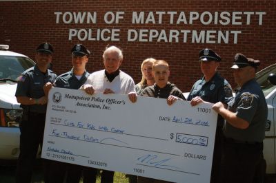 Cops for Kids
On April 28, Nicholas Claudio and his mother Alison Isherwood received a ‘big check’ for $5,000 from a partnership between Cops for Kids with Cancer and the Mattapoisett Police Officer’s Association. Claudio is a sophomore at ORRHS, an honor role student, and a cancer survivor. From Left to Right: Officers Adalbert Cardoso and Nicholas Lorenco, Cops for Kids with Cancer Chairman Robert Faherty, Mom Alison Isherwood, Nick Claudio, and Officers Turner Ryan and Kyle Pavao. Photos by Marilou Newell

