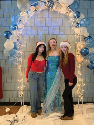 Old Colony Regional Vocational-Technical High School’s Winter Wonderland 
Playing the “Frozen” character Elsa of Arendelle, Bea Ashley is joined by Ayvia DaSilva, left, and Sophia Lyndon during Old Colony Regional Vocational-Technical High School’s Winter Wonderland event hosted Friday by the Rochester-based school’s National Honor Society members. Children of all ages met and were photographed with Santa and Elsa, while others pinned the nose on Rudolph, made ornaments and enjoyed eating yummy treats. Photo by Marilou Newell- Dec. 21, 2023 edition
