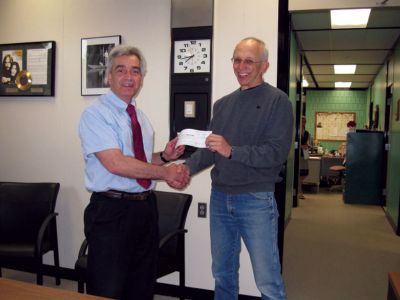 Green Committee
Gary Brown (left), superintendent of Old Colony, receives a check from David Smith (right), in the amount of $1,333 for Old Colonys Green Committee, which works to incorporate green technology into the schools vocational programs. The money was raised from a recent electronics and appliance recycling program, held in conjunction with the Green Fair at Old Colony. 
