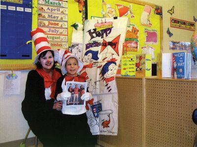 March is Reading Month
The students at Center School in Mattapoisett honored the month of the Young Reader and Dr. Seuss birthday on March 2. Children came dressed in stripes, wearing hats and toting copies of their favorite Dr. Seuss books. The cafeteria served green eggs and ham for lunch, and throughout the day, everyone enjoyed many of the wonderful books that Dr. Seuss wrote. Pictured here are second grade teacher Maria Tomon and second grader William Gauvin.
