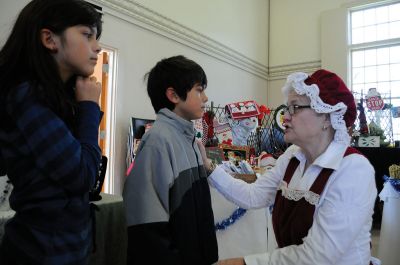 Christmas Faire
Mrs. Claus gets the scoop on who has been naughty or nice at the November 12, 2011 Mattapoisett Congregational Church Christmas Faire. Photo by Felix Perez.
