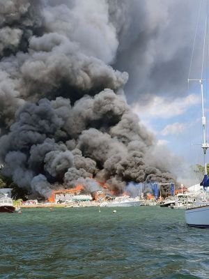 Mattapoisett Boatyard Fire
Smoke rose over Mattapoisett Harbor on August 19 after a boat caught fire during the replacement of a gasoline tank. An explosion followed by a raging fire leveled Mattapoisett Boatyard and destroyed the 14 boats and 47 vehicles on site. Members of the Kaiser family who own the business and members of the McLean family who founded the business surveyed the ruins on the weekend and vow to rebuild. Photos by Marilou Newell and courtesy of Mattapoisett Police and Fire departments and Kathleen Costello
