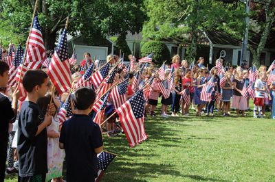 Flag Day
The students of Center School observed Flag Day, Friday, June 14, outside near the flagpole. Also being the last day of school for the year, Principal Rosemary Bowman addressed the children, reminding them how blessed they are to be American and living in Mattapoisett. Photos by Jean Perry
