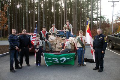 Holiday Food Drive
 Boy Scouts of Troop 32 in Marion celebrate during the last day of their food drive at the Marion Police Department.  The scouts collected over 200 items of non-perishable food for The Family Pantry- Damien’s Place in East Wareham.  Photo by Eric Tripoli.
