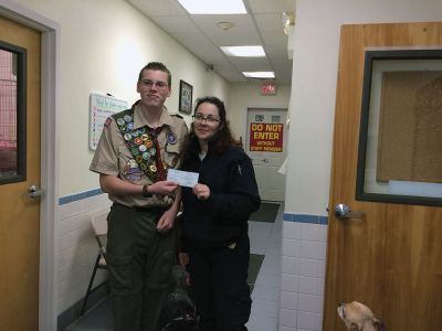 Freeman Bauer
Freeman Bauer of Mattapoisett presented Fairhaven Animal Shelter Officer Kelly Massey with a check in the amount of $1,600 for animal rescue. Bauer held a Dog Walk-a-thon as his Eagle project, raising funds for a cause very near to his heart. Photo courtesy of Jodi Bauer
