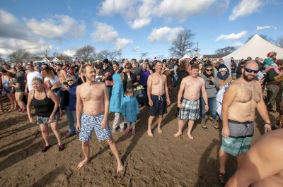 “Freezin’ for a Reason” 
Every year hundreds make waves on New Year’s Day at the Mattapoisett Town Beach for the annual “Freezin’ for a Reason” polar plunge. With the support of local businesses and emergency responders, the event has continued every year, raising thousands of dollars to help local families facing cancer treatment. Photos by Felix Perez
