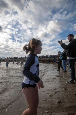 “Freezin’ for a Reason” 
Every year hundreds make waves on New Year’s Day at the Mattapoisett Town Beach for the annual “Freezin’ for a Reason” polar plunge. With the support of local businesses and emergency responders, the event has continued every year, raising thousands of dollars to help local families facing cancer treatment. Photos by Felix Perez
