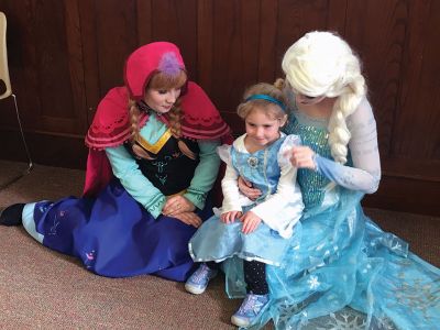 Frozen Princesses
On December 21, two princesses visited the Mattapoisett Public Library to read stories and sing songs from the Disney film Frozen. Princesses Elsa and Anna beguiled the children as well as their parents in an hour-long performance culminating in hugs and a photo session. The delightful event was sponsored by the Friends of the Mattapoisett Library. Photos by Marilou Newell
