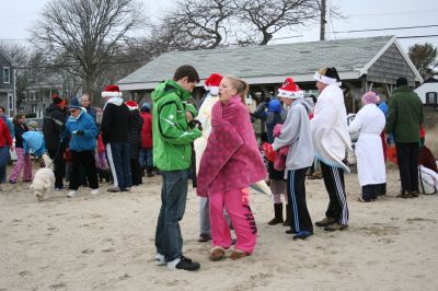 Christmas Day Swim
Helping Hands and Hooves hosed their 11th annual Christmas Day Swim at 11:00 am at the Mattapoisett Town Beach. Helping Hands and Hooves is a non-profit (based in Mattapoisett) that is dedicated to providing therapeutic horseback riding lessons for adults with disabilities. If you would like to learn more about Helping Hands and Hooves you can visit their website at www.helpinghandsandhooves.org. Photo by Robert Chiarito
