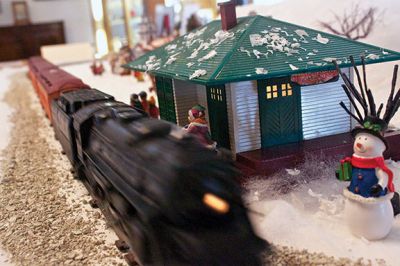 Holiday Tour
The Mattapoisett Historical Society and Carriage House opened its doors for the holiday season on Saturday, November 24.  The Historical Society is having its annual holiday shop, which features a variety of unique gifts such as historical postcard and map recreations, books, and tree ornaments.  Kids will get a kick out of the Lionel model train that zooms past a village of illuminated porcelain buildings. Photos by Eric Tripoli.  
