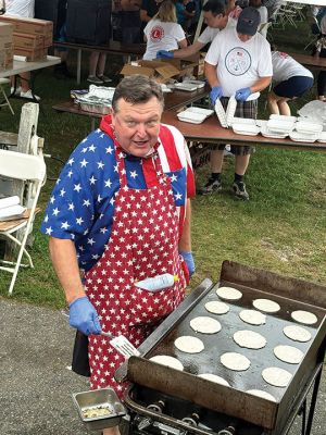 Harbor Days 
Cakes were on the griddle, and patriotism was in the air, as residents and visitors were greeted by the annual Harbor Days festival hosted by the Lions Club last weekend in Shipyard Park. Photo courtesy of the Mattapoisett Lions Club and Immediate Past King Lion Robert Haley
