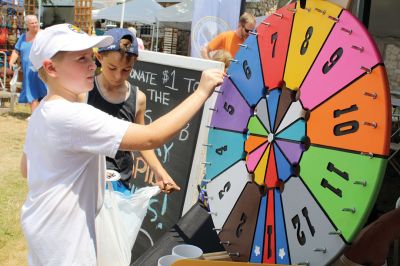 Harbor Days 
Harbor Days came to Mattapoisett this past weekend, and many visitors were gracious enough to spin The Wanderer Wheel for a $1 donation to the Lions Club. Those who played helped raise an extra $523 the Lions Club will use to benefit the community. The Aardvark came out too, but since furry aardvarks hate hot weather, he only made a couple of appearances. Photos by Jean Perry
