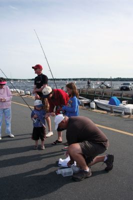 Fish Story
The Buzzards Bay Anglers Club hosted the First Annual Gus Casassa Scup Cup fishing tournament at the Mattapoisett Wharves on Saturday, July 11. The event attracted about 20 youngsters aged twelve and younger with each child receiving a new fishing rod and reel as part of their entry. Winners, who caught the largest fish of the day, also were awarded plaques for their efforts. Photo by Robert Chiarito.
