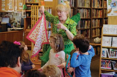 Irish Fairy Godmother
Bringing with her a magical teapot, the Irish Fairy Godmother visited the Joseph H. Plumb Memorial Library March 7, treating about 25 kids to a magic show. Magician Debbie O’Carroll said her favorite part about being the Irish Fairy Godmother is seeing the cheerful responses from her young audience. Photos by Felix Perez
