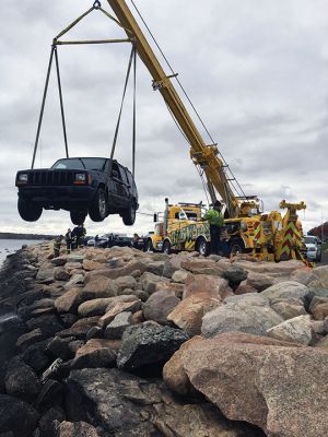 SUV at Ned's Point
An SUV crashed into Mattapoisett Harbor on Monday morning at Ned’s Point. The 19-year-old driver escaped on her own without serious injury, but was transported to the hospital with minor injuries. Photo courtesy Mattapoisett Fire Department
