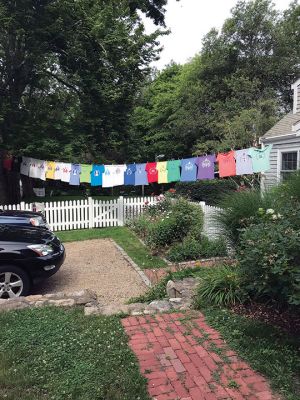 Mattapoisett Road Race
For years, the Kassabian family has inspired competitors in the Mattapoisett 5 Mile Road Race by hanging official race T-shirts of the past in front of their Church Street home along the racecourse. Courtesy of Laurie Kassabian

