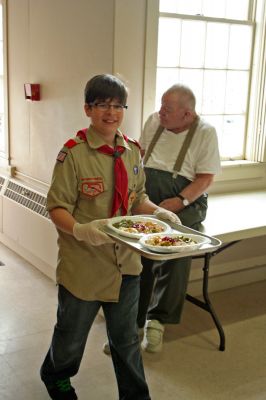 Lion's Dinner
The Mattapoisett Lions Club, with help from Mattapoisett Boy Scout Troup 53, welcomed about one hundred seniors to Mattapoisett Congregation Church's Reynard Hall for a special afternoon dinner on Saturday April, 18. The Lions Club served a hot turkey supper with all of the trimmings and also provided musical entertainment for the diners listening pleasure. Photo by Robert Chiarito
