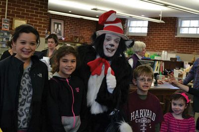 Mattapoisett Free Library Birthday
“Say Triskaidekaphobia!” the Cat in the Hat told the children, posing for a photo at the Mattapoisett Free Library on Saturday, March 22. What the heck is that, the children asked the Cat in the Hat. “Google it!” he told the children laughing at his silliness. The library knows how to throw a party, celebrating five years since the Friends of the Mattapoisett Library funded the expansion of the library. “They even bought a cake,” said Children’s Services Librarian Sandra Burke.  By Jean Perry
