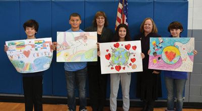 Mattapoisett Lion’s Club Peace Poster Contest
In November the Mattapoisett Lion’s Club held a Peace Poster contest at Old Hammondtown School for the 6th graders.  There were 80 participants this year!  This years’ theme was “Love, Peace and Understanding”.  The winners were: First Place: Spencer Perez-Dormintzer; 2nd Place Kayli Viera; 3rd Place: Maggie Berry & Andrews. Photographed are (left to right): Spencer Perez-Dormintzer, Wayne Andrews, King Lion Marianne DeCosta, Maggie Berry, Mattapoisett Lion and Kayli Viera.
