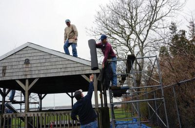 Mattapoisett Lions Club
Despite cool raining weather members of the Mattapoisett Lions Club joined together on Saturday April 20th to repair the shade shed at Ned’s Point, including a new roof.  The following Saturday the members repaired the shade shed at the town beach.  Both shade shed were originally built by the members of the Lions Club. 
