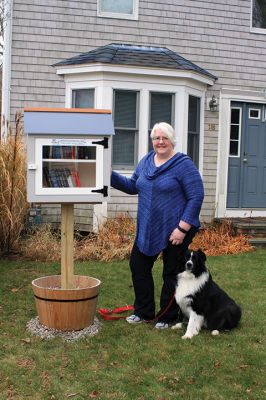Little Library
Mary Kathleen Briand and her dog Boone are stewards of the Little Free Library in Briand’s front yard located on Hammond Street next to the tennis courts at Center School. Little Free Library is a book exchange program where you may take a book and/or leave a book for free. The little library movement was established to promote literacy and access to books around the globe. Photo by Marilou Newell
