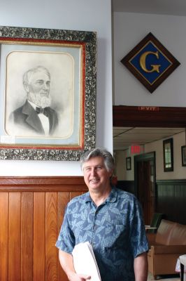Masonic Anniversary
Current Marion Pythagorean Lodge Master Tom Dexter stands in front of a portrait of David P. Hiller, one of the founders of the Pythagorean Lodge. The Pythagorean Lodge organization will be celebrating their 150th anniversary in July 2011. Photo by Joan Hartnett-Barry.
