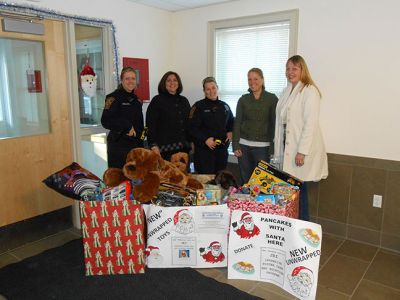 Marion Toy Drive
On Thursday 12, 2013 representatives of Justice Resource Institute came to the Marion Police Department to pick up the donations that were made during the Pancakes with Santa eveny on November 7. Pictured here, Officer Karen Ballinger, Susan Mazzarella (Director JRI), Officer Alisha Crosby, Ali Silveria (JRI staff), Teri Morton (JRI staff).
