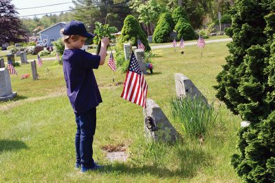 Memorial Day
Marion Boy Scouts, town employees, and volunteers spend Saturday morning planting flowers on veteran’s graves at Evergreen Cemetery, one of the ways Marion honors its veterans every year come Memorial Day. Photos by Robert Pina

