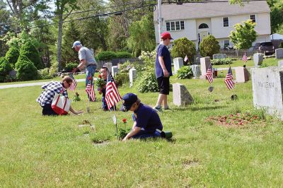 Memorial Day
Marion Boy Scouts, town employees, and volunteers spend Saturday morning planting flowers on veteran’s graves at Evergreen Cemetery, one of the ways Marion honors its veterans every year come Memorial Day. Photos by Robert Pina
