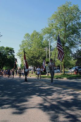 A procession on Front Street that began at the Music Hall culminated with Marion’s Memorial Day Remembrance ceremony at Old Landing. From left, Marion Select Board members Norm Hills, Toby Burr and Randy Parker, Town Administrator Jay McGrail, keynote speaker former U.S. Marines Corporal Jack McLean and master of ceremonies Air Force Major Andrew Bonney. Contributing to the observances were Father Eric Fialho of St. Gabriel’s Episcopal Church, Boy Scouts, Girl Scouts, Cub Scouts and Brownies, the Sippican E
