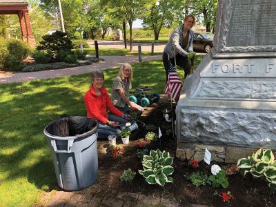 Veteran’s Memorial
Volunteers Dana Anderson, Patty Nicholson, and Alanna Nelson are planting the Veteran’s Memorial, an annual event prior to Marion’s celebration on Memorial Day to honor those who sacrificed their lives in past wars. Photo by Tinker Saltonstall
